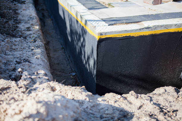 Professional Waterproofing technician working in Romney, IN